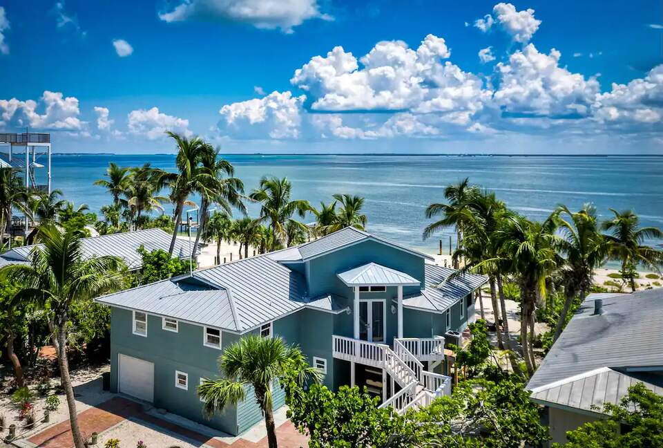Latitude Adjustment- Beachfront with an Amazing Lit Private Fishing Dock w/ Sunrise Views - North Captiva, Florida