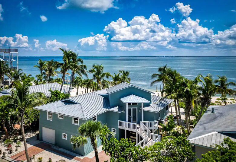 Latitude Adjustment- Beachfront with an Amazing Lit Private Fishing Dock w/ Sunrise Views - North Captiva, Florida