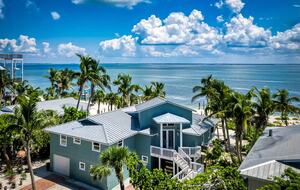 Latitude Adjustment- Beachfront with an Amazing Lit Private Fishing Dock w/ Sunrise Views - North Captiva, Florida