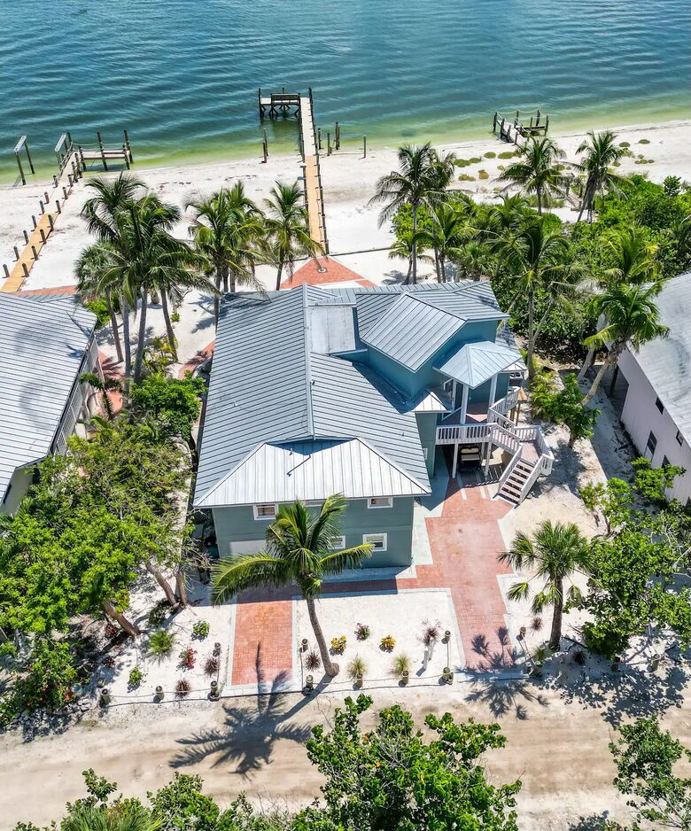 Latitude Adjustment- Beachfront with an Amazing Lit Private Fishing Dock w/ Sunrise Views - North Captiva, Florida