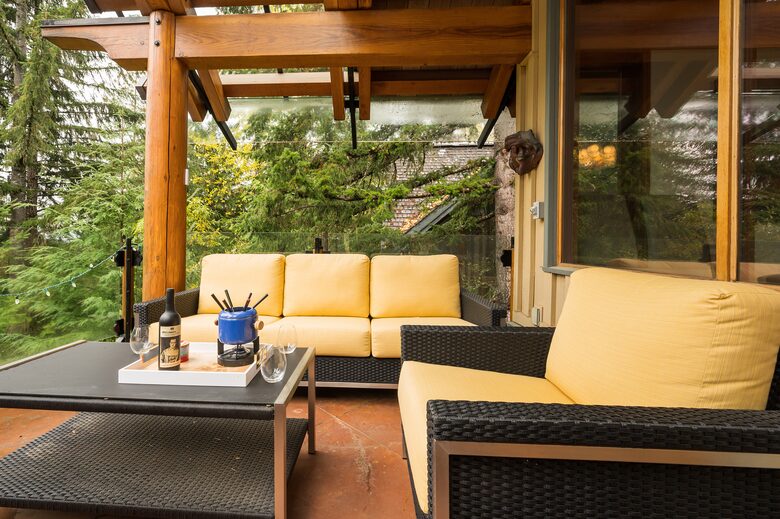 Amazing deck area overlooking creek - covered with glass roof