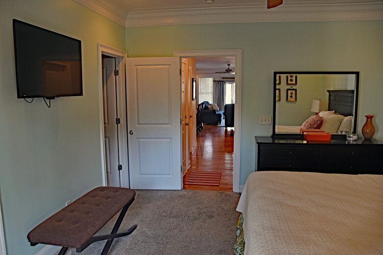 First Floor Master Bedroom with TV, Full Bath, Dresser and Private Dec