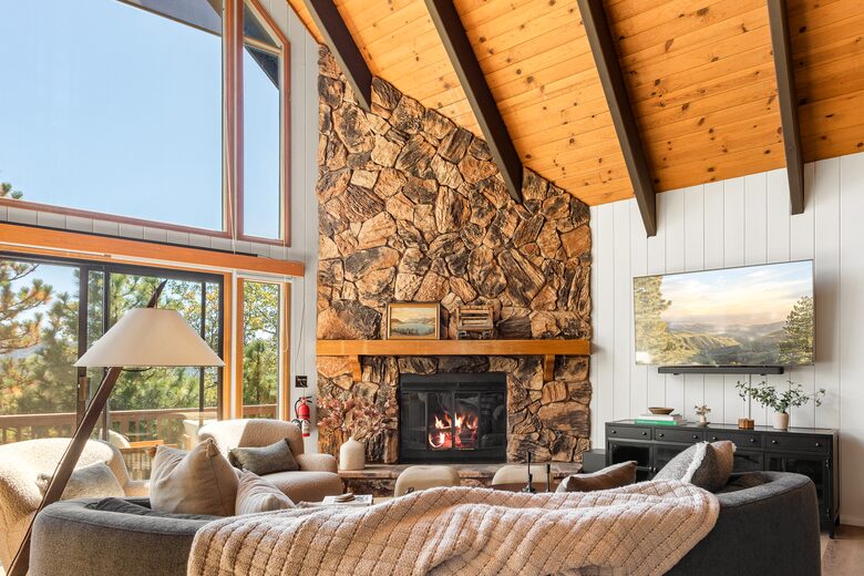 Vaulted ceilings, fireplace, and mountain views