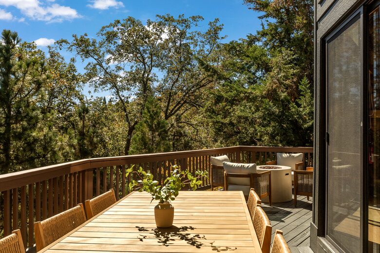 Expansive upper deck with dinning, firepit and bbq grill
