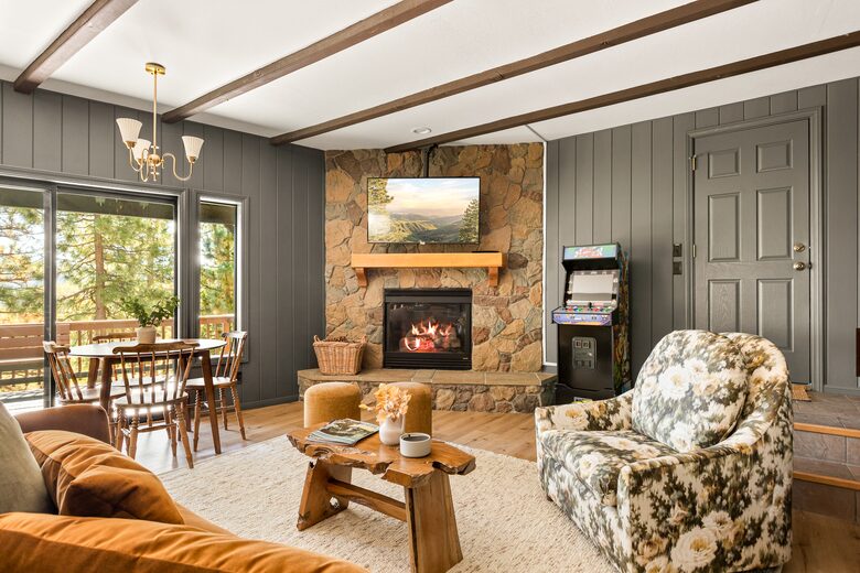 Game room with fireplace, TV, arcade