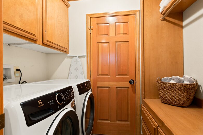 Laundry room with full size washer and dryer