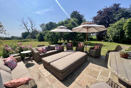 Garden Terrace with table & sofas - garden & meadow views