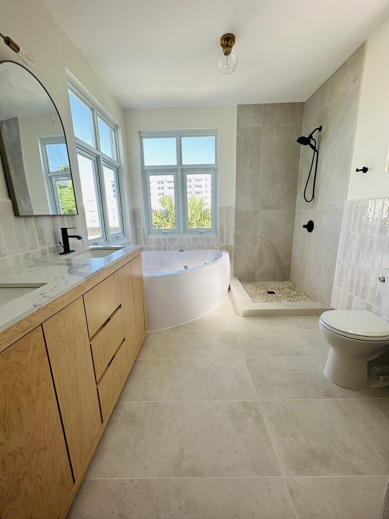 Master bathroom with shower & large jacuzzi tub (ocean view)