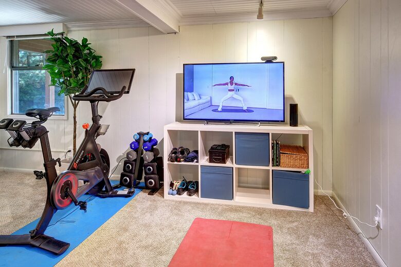 Exercise area with Peloton and smart TV