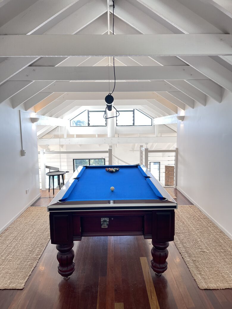Pub size pool table in loft area