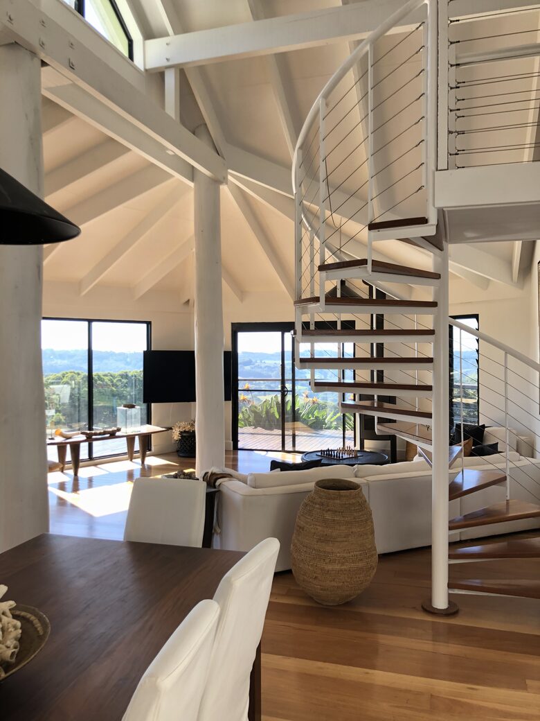Living area spiral stairs to loft pool table room
