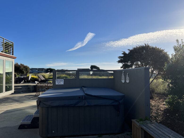 Hot tub in side patio area.