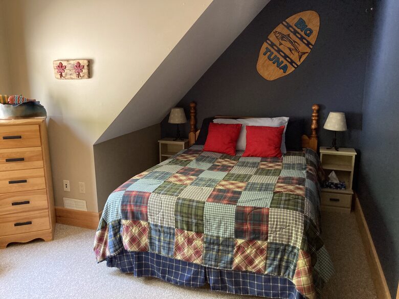 upstairs bedroom with queen bed
