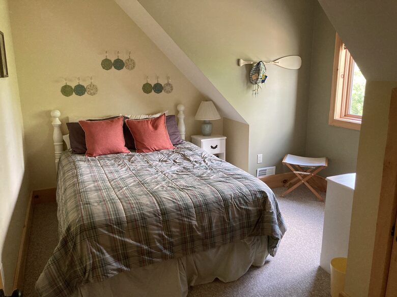 upstairs bedroom with queen bed