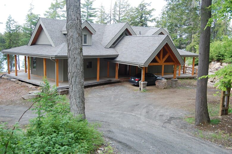 carport with covered porch around cottage