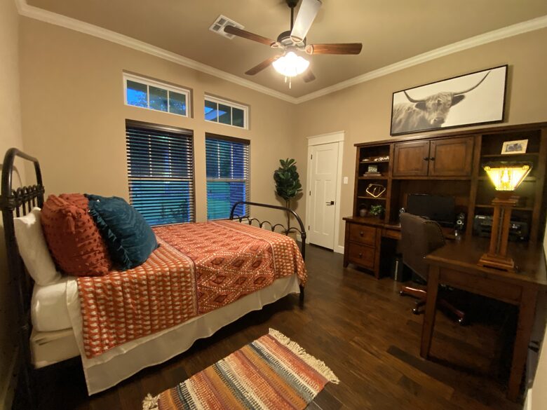 Bedroom 4 with queen size bed and access to hall bath with shower