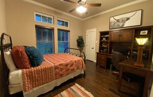 Bedroom 4 with queen size bed and access to hall bath with shower