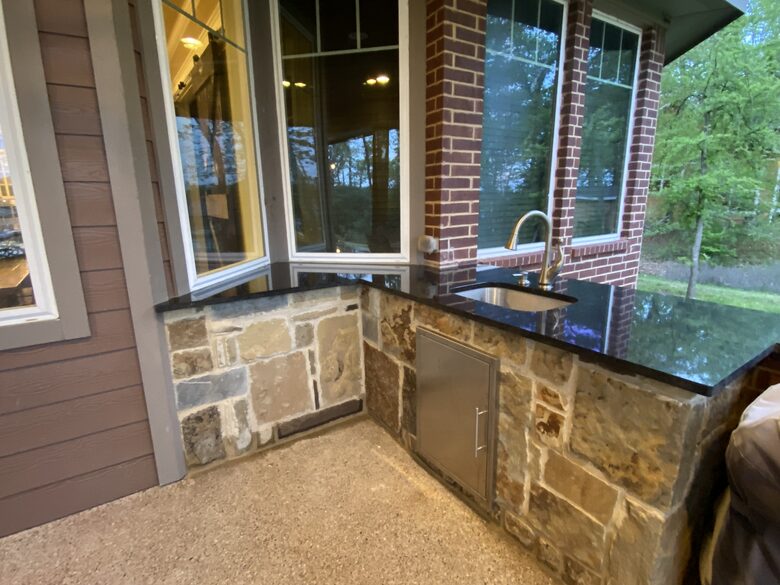 Outdoor kitchen with sink, gas grill and side burner