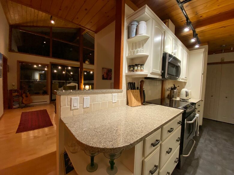 Galley kitchen and view to living room