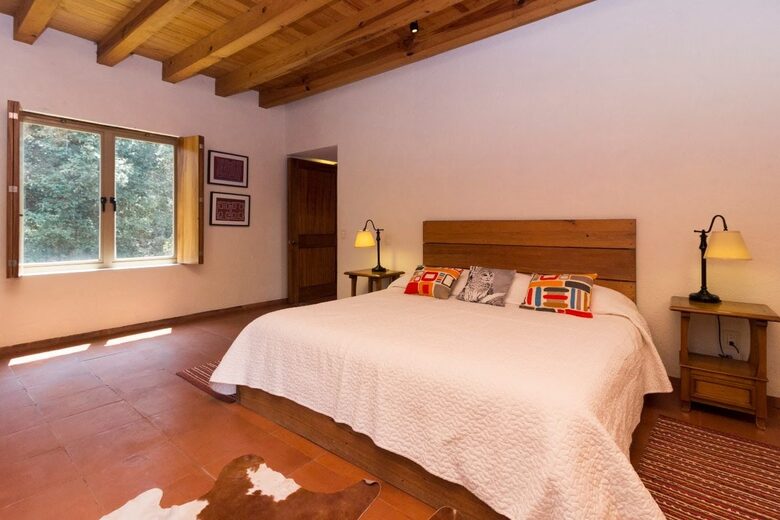 Upstairs bedroom with a king bed and a day bed