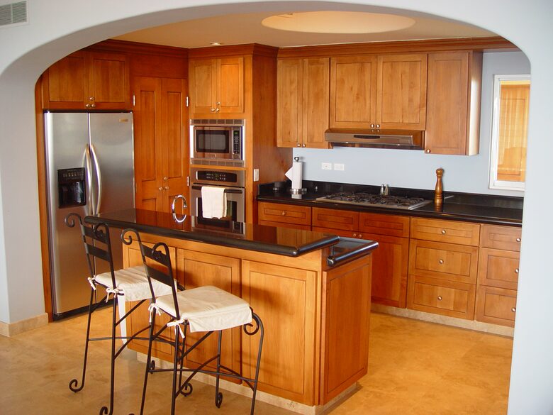 Kitchen with all major appliances, dishes, and cookware