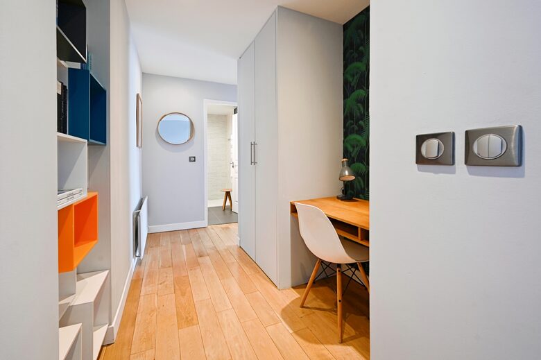 A cosy office nook provides ample space for occasional work