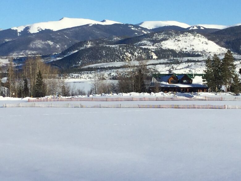 Front of home from top of meadow with Lake Dillon in backgrd
