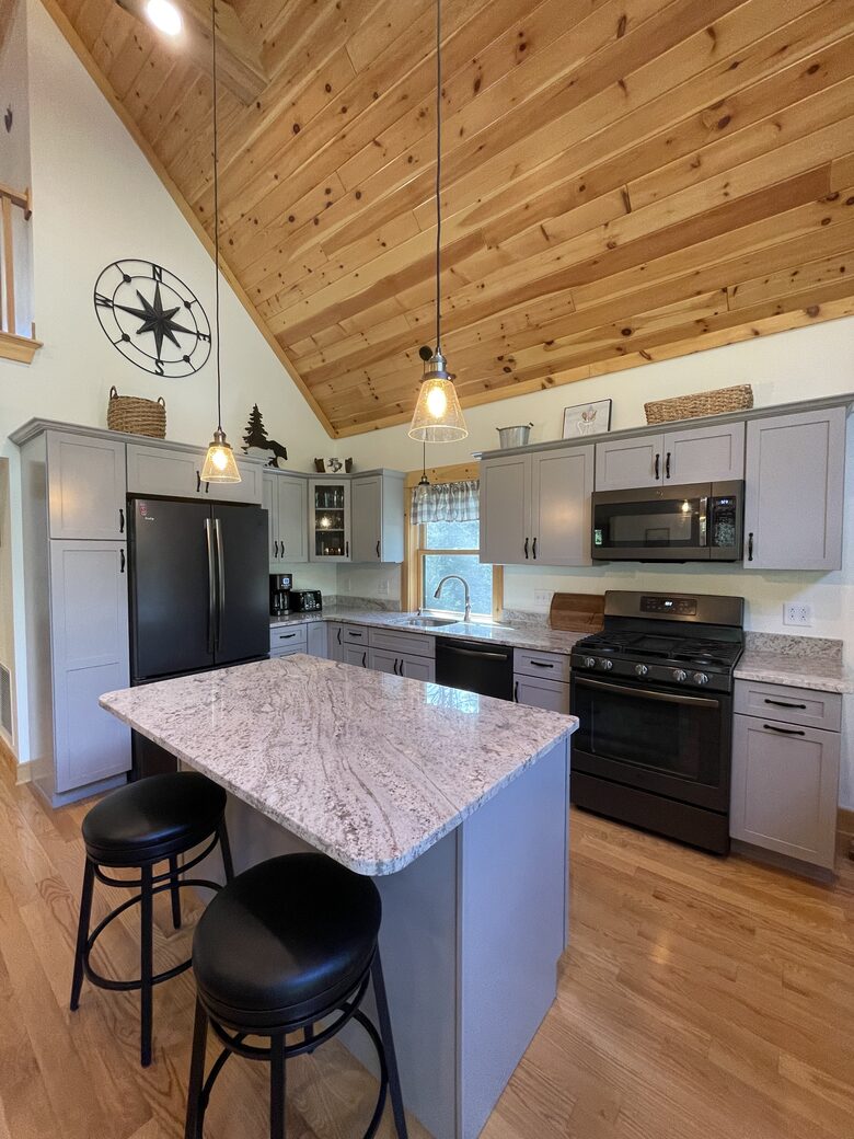 Well-appointed kitchen with pancake griddle stove.