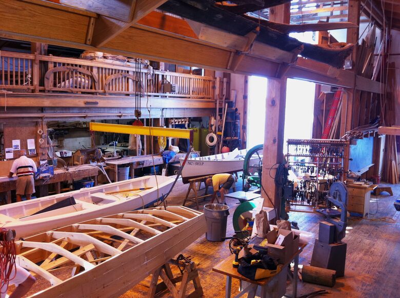 Traditional wooden skiffs being built at Watercraft Center