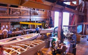 Traditional wooden skiffs being built at Watercraft Center