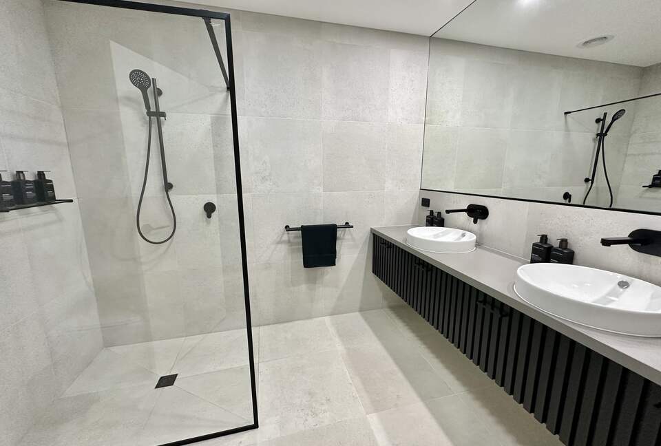 2nd of 4 bathrooms with batten dual basin vanity