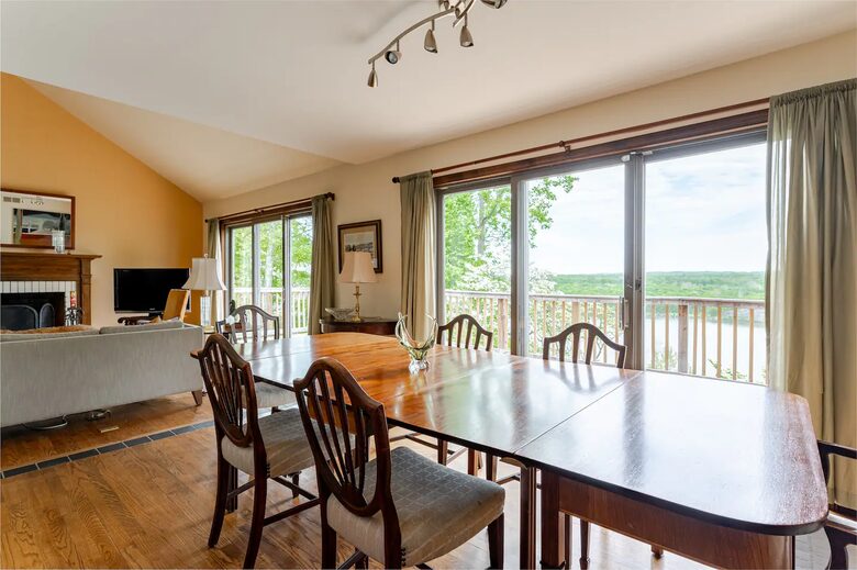 Formal dining area, deck and river