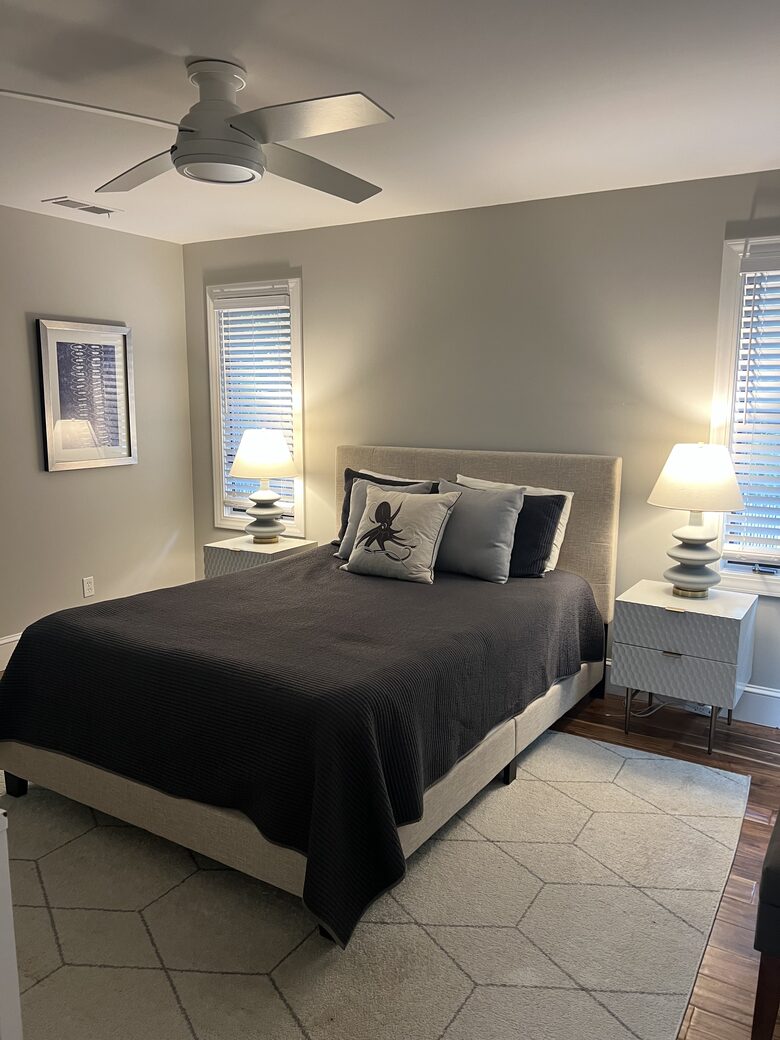 Master bedroom with glass doors to screened porch