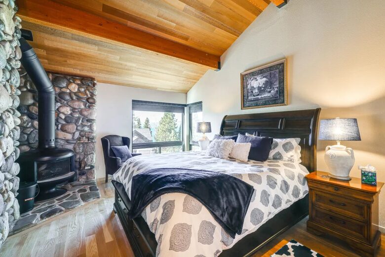 Upper Master w/ wood burning fireplace & partial Lake views