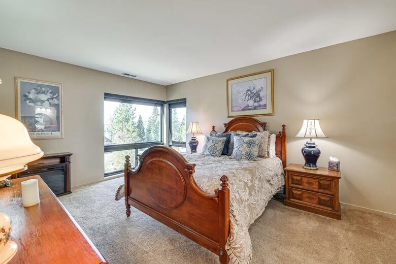 Lower master w/electric fireplace & partial lake views