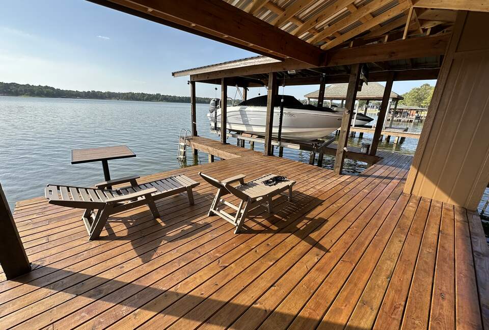 Covered dock with 2 loungers and table and chairs for 4
