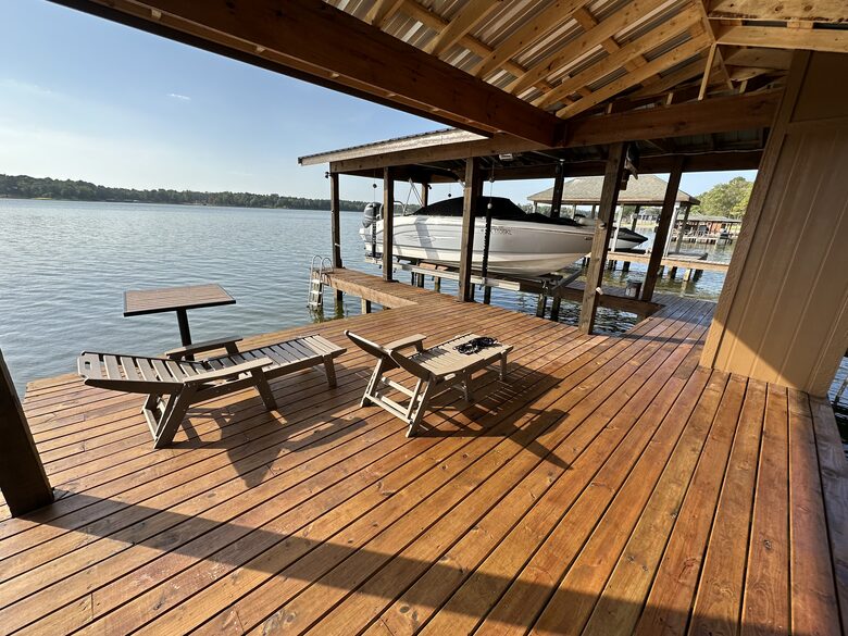 Covered dock with 2 loungers and table and chairs for 4