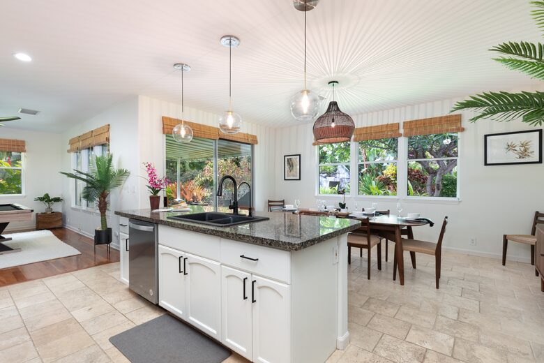 Kitchen with island open to living