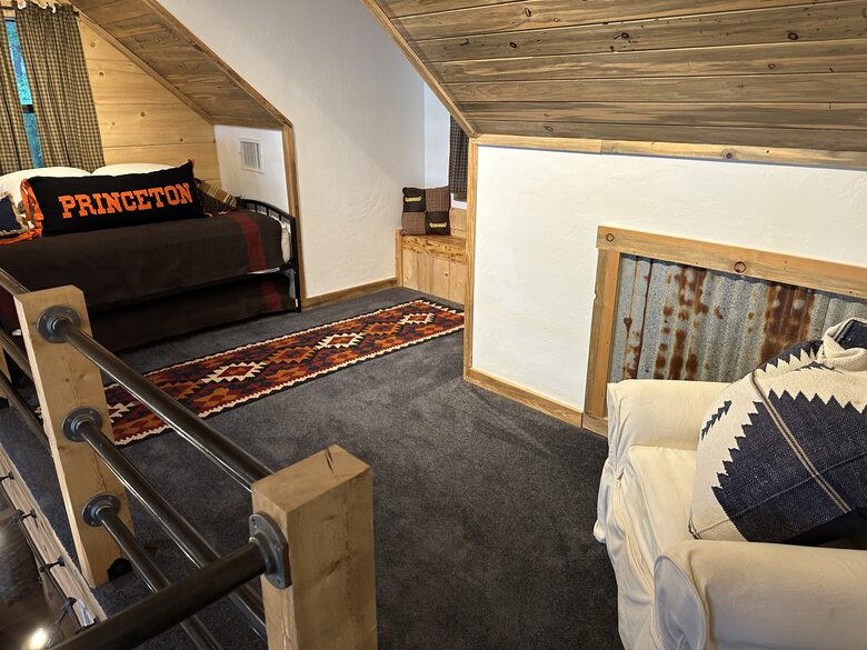 Upstairs sleeping lift features twin bed with twin trundle
