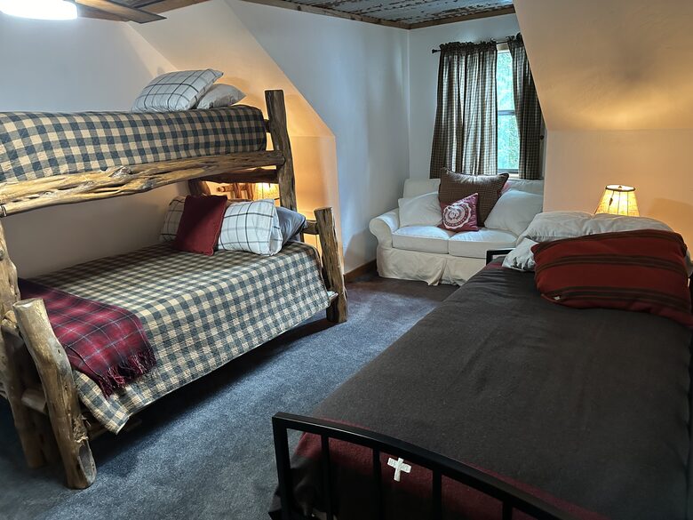 Bedroom 2 with queen and twin bunk, twin daybed with trundle