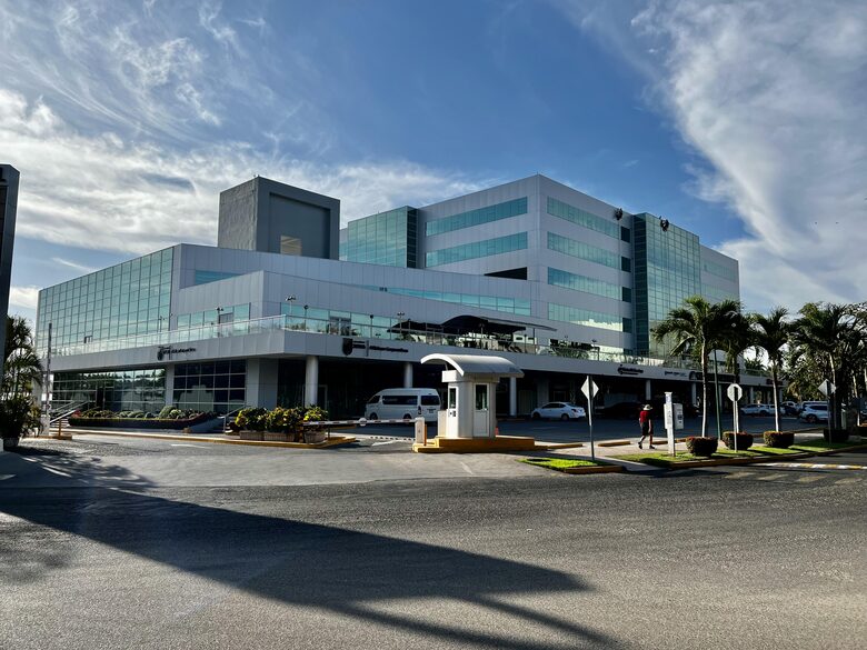 Just in front of this Hospital, pharmacy, restarurants, etc