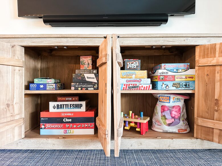 Living room cabinet with lots of games for all ages.