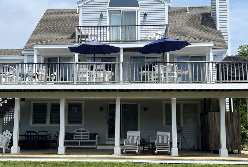 View from back of house two decks and private balcony overlooking yard