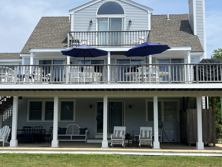 View from back of house two decks and private balcony overlooking yard