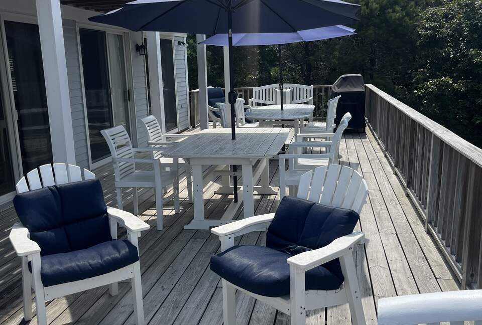 Second floor deck with grill and dining and seating