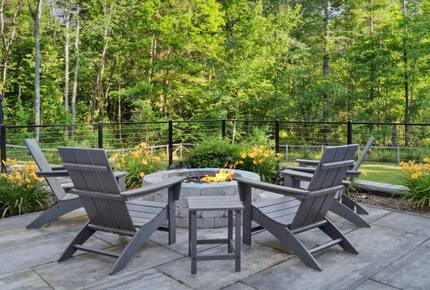 Fire pit overlooking backyard and pool area
