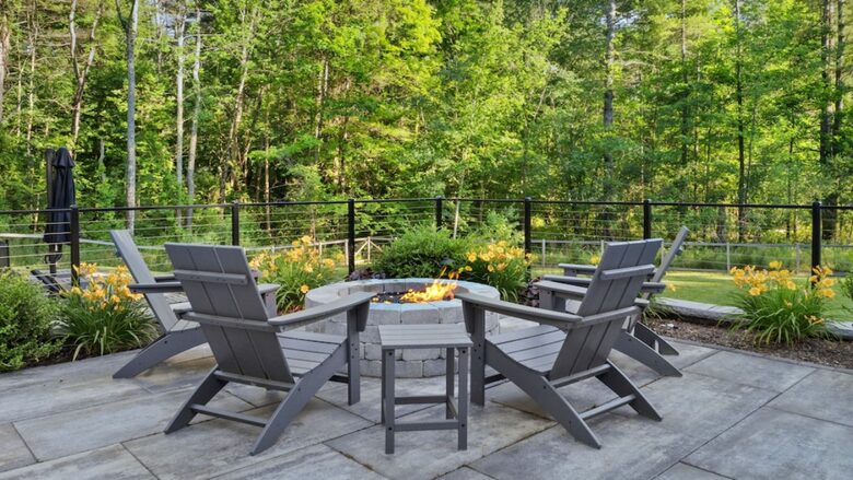 Fire pit overlooking backyard and pool area