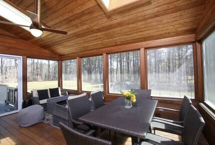 Screen-in porch is perfect for entertaining or reading a book
