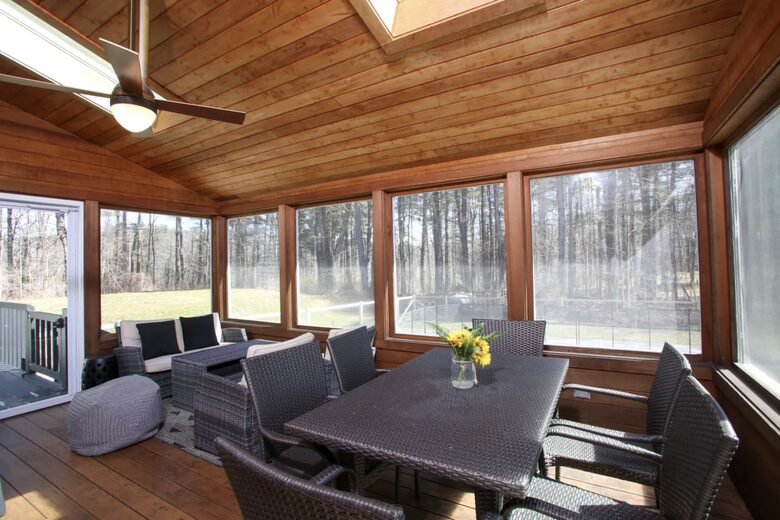 Screen-in porch is perfect for entertaining or reading a book