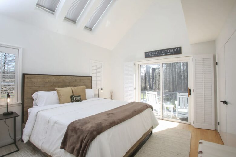 Downstairs primary suite has private deck with access to pool area